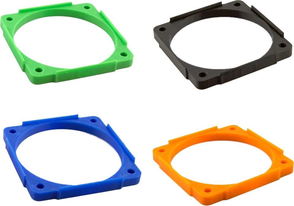 Printed 60mm fan adapter frames for Argon THRML heatsinks, shown in green, black, blue and orange